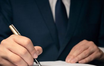 an attorney signing documents